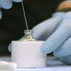 A 100-dose vial of smalllpox vaccine is tapped for Minnesota Department of Health employees. (Image: AP)